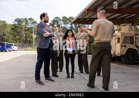 Mr. Patrick Nevins, left, and Ms. Sapna Sharma, center, both staff members of the House Armed Services Committee, discuss unit capabilities with U.S. Marine Corps Col. Robert Hallett, assistant division commander of 2nd Marine Division, during a house armed services committee staff member visit aboard Marine Corps Base Camp Lejeune, North Carolina, March 31, 2023. Mr. Patrick Nevins and Ms. Sapna Sharma, professional staff members of the House Armed Services Committee, visited II MEF and major subordinate commands to discuss amphibious readiness and shipping, force posture and other topics rel Stock Photo