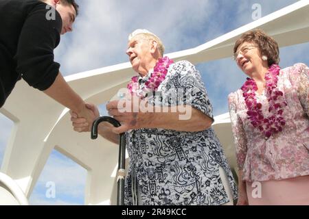 US Navy Pearl Harbor survivor shakes hands with other guests Stock Photo