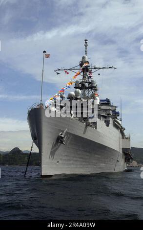 US Navy The command ship USS Coronado (AGF 11) sits in Shimoda Bay, in full dress ship Stock Photo