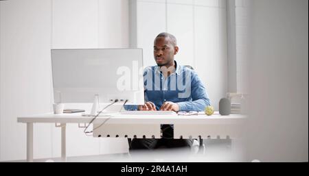 African American Business Man Using PC Computer Stock Photo
