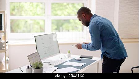 Taking Invoice Document Photo Using Phone Or Smartphone Stock Photo