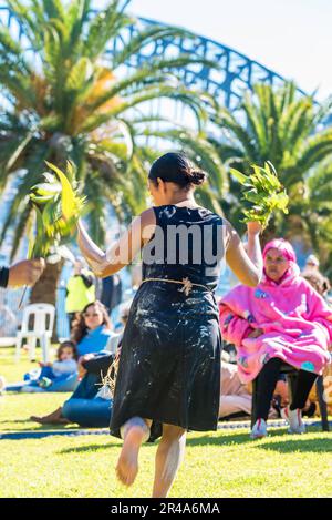 Sydney Australia 27 May, 2023: As part of National Reconciliation Week, a Sorry Day gathering was held today on the Tarpeian Precinct in the Botanical Gardens near the Sydney Opera House. People gathered to remember the stolen generations (of Aboriginal peoples) and create healing for survivors. Sponsored by the Coota Girls Aboriginal Corporation, the event included music crafts and bush foods. With the Sydney Harbour Bridge in the background, the Buuja Buuja Butterfly Dance Group performed at the opening of the gathering. Credit: Stephen Dwyer / Alamy Live News Stock Photo