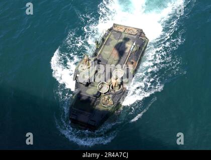 US Navy Marines assigned to the Assault Amphibian School Battalion, pilot an amphibious assault vehicle as they prepare to enter the well-deck aboard the amphibious assault ship USS Boxer (LHD 4) Stock Photo