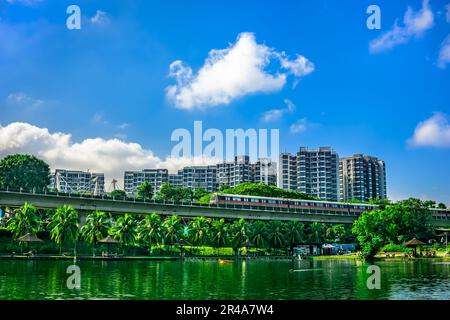 MRT Train passing with The Estuary codo in the background, Yishun Town, Singpore. Stock Photo