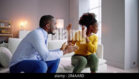 Angry Young African Man Screaming At Woman Stock Photo