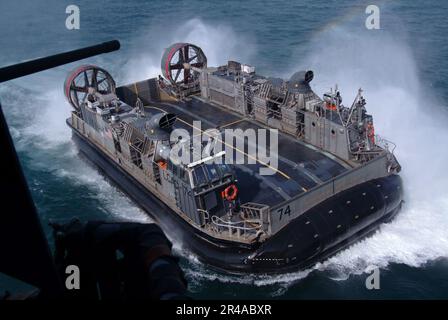 LCAC-74, assigned to Assault Craft Unit Five, approaches USS Essex (LHD ...