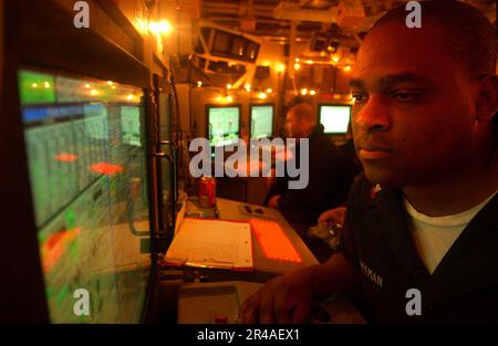 US Navy Gas Turbine Systems Technician 1st Class stands duty as Engineering Officer of the Watch in Damage Control Central Stock Photo