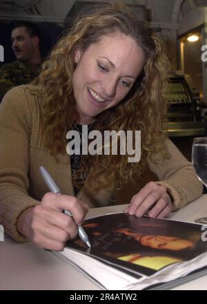 US Navy  Jerri Manthey of the hit television show Survivor, signs autographs and talks to crew members aboard the nuclear powered aircraft carrier USS Nimitz (CVN 68). Stock Photo