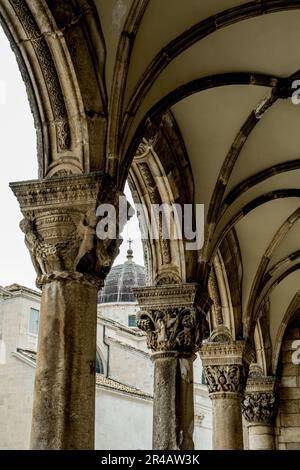 An array of vibrant pillars with ornamental designs Stock Photo