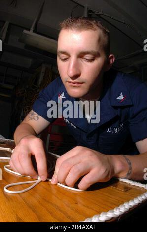 US Navy  Boatswain's Mate 3rd Class prepares a. Stock Photo