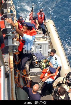 US Navy  A boarding team assigned to the guided missile cruiser USS Normandy (CG 60) transports Yemen Coast Guard Sailors to Normandy. Stock Photo