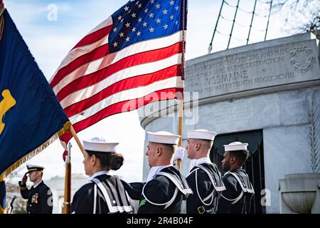 A color guard from the U.S. Navy Honor Guard supports a ceremony commemorating the 125th anniversary of the sinking of the USS Maine, Arlington National Cemetery, Arlington, Va., Feb. 15, 2023.    On Feb. 15, 1898, the USS Maine exploded off the coast of Havana, Cuba, leading to the loss of 260 of her crew. Due to Spanish policy, burials had to be made within 24 hours, therefore the initial crew recovered in the aftermath of the disaster were buried at the Colon Cemetery in Havana. On March 30, 1898, Congress approved a bill authorizing for their remains to be disinterred and transferred to AN Stock Photo