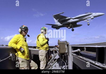 US Navy  Lt. stand watch as an F-A-18E Super Hornet conducts a wave-off. Stock Photo
