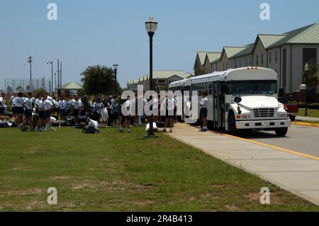 US Navy  Students assigned to Naval Aviation Technical Training Center (NATTC) load onto buses as they prepare to evacuate. Stock Photo