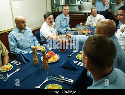 Chief Selectee Chief Petty Officer selectee shakes hands with Master Chief Petty ...