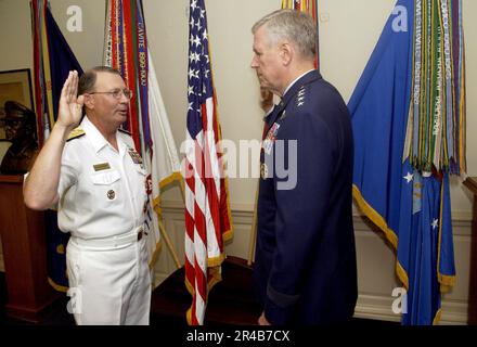 US Navy  Adm. Edmund P. Giambastiani, left, is administered the oath of office as Vice Chairman of the Joint Chiefs of Staff. Stock Photo