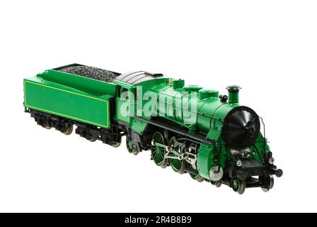 Isolated toy steam locomotive with a coal trailer Stock Photo