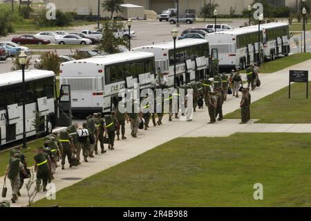 US Navy  Marines assigned to Aviation Maintenance Squadron Two (AMS-2) on board Naval Air Station Pensacola, Fla., board buses which will evacuate them to Marine Corps Logistics Base Albany, Ga. Stock Photo