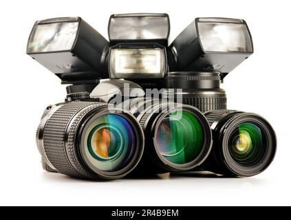 Composition with photo equipment including zoom lenses, camera and flash lights isolated on white Stock Photo