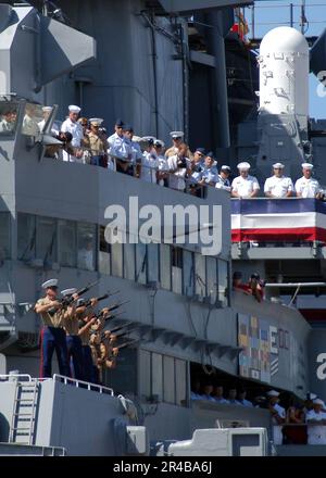 US Navy  A U.S. Marine Corps rifle detail fires off a salute during the 60th anniversary of the end of World War II ceremony aboard the Battleship Missouri Memorial at Pearl Harbor. Stock Photo