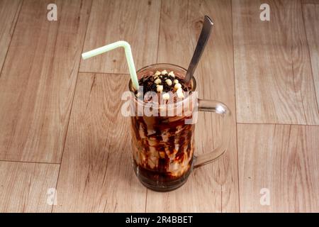 chill Chocolate Falooda in glass on wooden background Stock Photo
