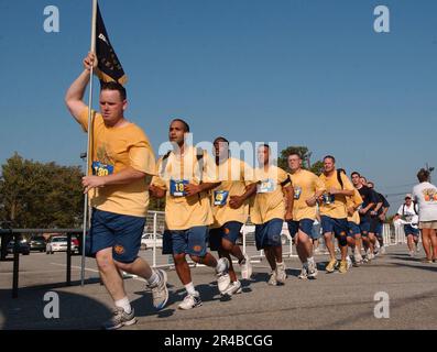 US Navy  Chief petty officers (CPOs) and CPO selectees near the finish line at the Run with the Chiefs 8K Race. Stock Photo