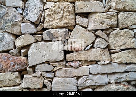 A vibrant image of an array of red bricks arranged in a line along a city street Stock Photo