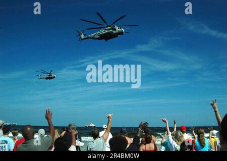 US Navy  Jacksonville, Fla., citizens wave as U.S. Navy look on as MH-53E Sea Dragon helicopters pass over. Stock Photo