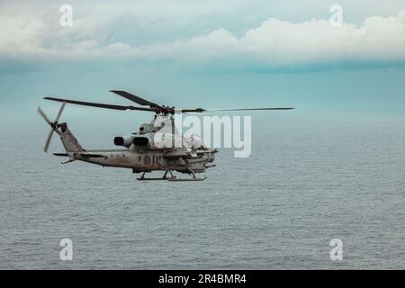 U.S. Marines with Marine Medium Tiltrotor Squadron 262 (Rein.), 31st Marine Expeditionary Unit, pilot an AH-1Z Viper during an special weapons delivery training in the Philippine Sea, Feb. 2, 2023. The specific weapons delivery training increased the squadron’s weapons proficiency in close air support. The 31st MEU is operating aboard ships of the America Amphibious Ready Group in the 7th Fleet area of operations to enhance interoperability with allies and partners and serve as a ready response force to defend peace and stability in the Indo-Pacific region. Stock Photo