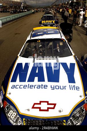 US Navy  The NASCAR Busch No. 88 Navy - Accelerate Your life Chevrolet Monte Carlo of the Dale Earnhardt Jr. Racing Team, lines up in front of the No. 14 Navy Accelerate Your Life Dodge Charger. Stock Photo