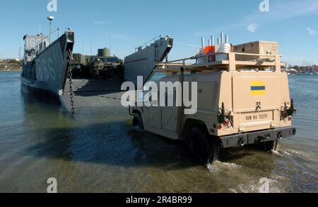 US Navy  A U.S. Marine Corps truck drives onto Landing Craft Utility One Six Six Six (LCU-1666) assigned to Amphibious Craft Unit One (ACU-1) based at Naval Amphibious Base Coronado, Calif. Stock Photo