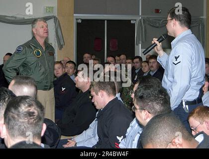 US Navy  Damage Controlman 3rd Class address a question to Commander, U.S. Pacific Fleet, Adm. Gary Roughead, during an All-Hands Call. Stock Photo