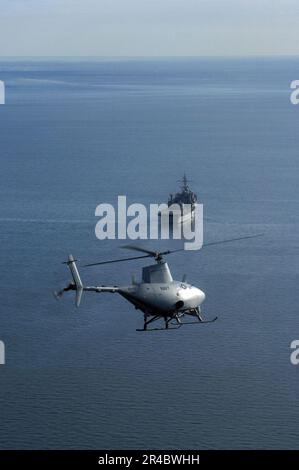 US Navy  A RQ-8A Fire Scout Vertical Takeoff and Landing Tactical Unmanned Aerial Vehicle (VTUAV) System prepares for the first autonomous landing aboard the amphibious transport dock ship USS Nashville (LPD 1. Stock Photo