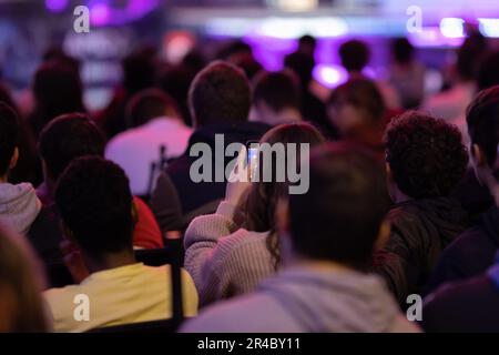 Audience listens to the speech of the lecturer in the hall. Mid shot Stock Photo