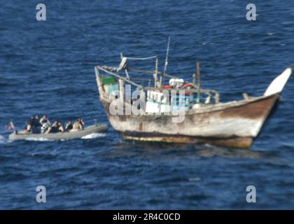 US Navy  Boarding team members assigned to the guided missile destroyer USS Gonzalez (DDG 66) prepare to board an Iranian dhow. Stock Photo