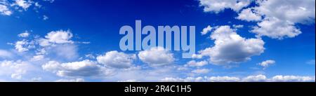 Blue sky background with white clouds. Panoramic image Stock Photo