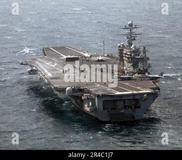 US Navy  F-14D Tomcats launch from the flight deck of Nimitz-class aircraft carrier USS Theodore Roosevelt (CVN 71) to their homeport of Naval Air Station Oceana. Stock Photo