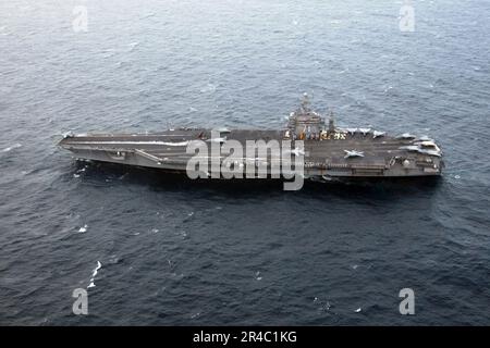 US Navy  F-14D Tomcats launch from the flight deck of Nimitz-class aircraft carrier USS Theodore Roosevelt (CVN 71) to their homeport of Naval Air Station Oceana. Stock Photo