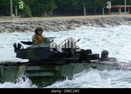 US Navy  An Amphibious Assault Vehicle (AAV) assigned to the 31st Marine Expeditionary Unit (MEU) leaves the beach to head towards the amphibious dock landing ship USS Harpers Ferry (LSD 49). Stock Photo