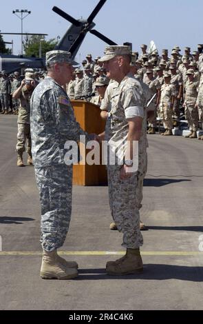 US Navy  U.S. Marine Corps Maj. Gen. Timothy F. Ghormley receives the Superior Defense Service Medal from Commander, U.S. Central Command (CENTCOM) U.S. Army Gen. John P. Abizaid. Stock Photo