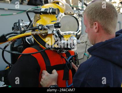 US Navy  Sonar Technician Surface 3rd Class is suited for his Master Diver qualification pre-screening exercise aboard Landing Craft Unit (LCU-1647) at Naval Amphibious Base Little Creek. Stock Photo