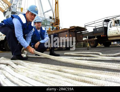 US Navy Line handlers assigned the amphibious transport dock ship USS ...