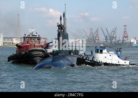 US Navy The Pre-Commissioning Unit (PCU) Texas (SSN 775) sails into the Northrop Grumman Newport News shipyards with assistance of three tugboats after successfully completing its alpha sea trials. Stock Photo