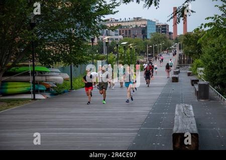 Washington, DC - Members of the DC Run Crew run on the Anacostia Riverwalk Trail. Stock Photo