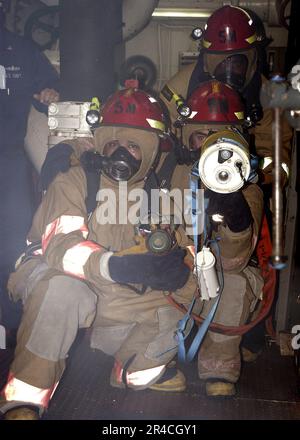 US Navy Damage Controlman 2nd Class uses a Portable Exothermic Cutting ...