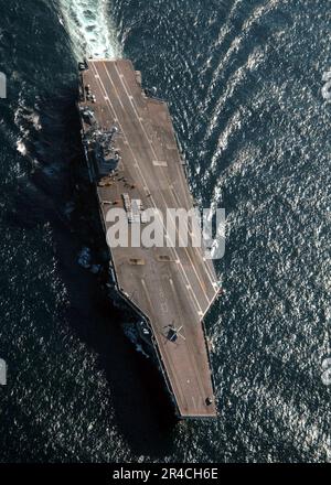 US Navy  USS Theodore Roosevelt (CVN 71) conducts a vertical replenishment (VERTREP) with the Military Sealift Command (MSC) ammunition ship USNS Mount Baker (T-AE 34). Stock Photo