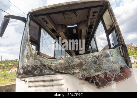old neglected bus with broken front window, Shattered window glass transportation, Broken windshield window glass Stock Photo