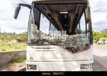 old neglected bus with broken front window, Shattered window glass transportation, Broken windshield window glass Stock Photo