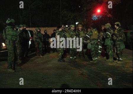 Members of the Wing Inspection Team discuss the outcome of the ...