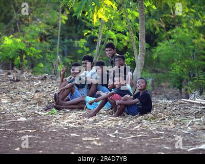 Maumere, Flores, Indonesia- May 23, 2023: Asian boys smiling looking at the camera. Stock Photo